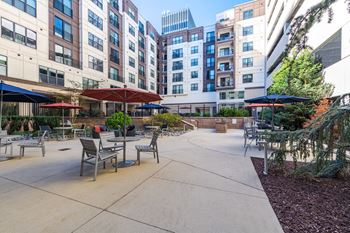 A courtyard with tables and chairs